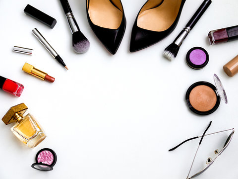 cosmetics top view on a white table. Workplace, cosmetics, lipstick, nail Polish, mascara and eyeshadow