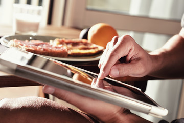 young man using a tablet