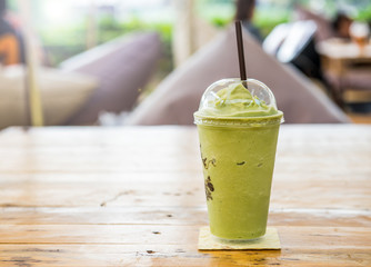 green tea frappe and blended on table