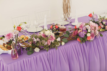 The flowers at the wedding table. Tent.