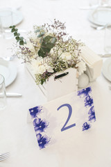 Wedding reception in a white tent.