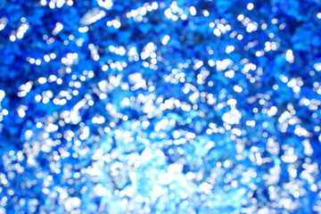 unfocus bokeh light in blue swimming pool background