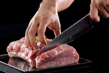 Meat, pork, slices pork loin on a black background