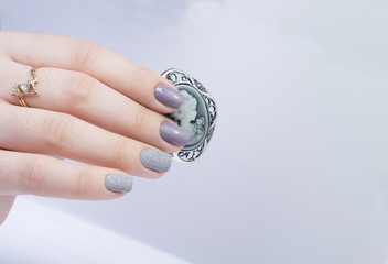 Beautiful hands and natural nails, ideal clean manicure. Decorated with stylish elements