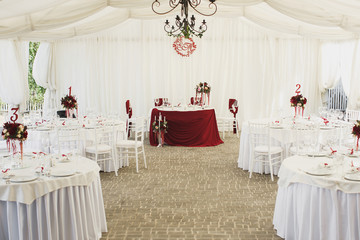 Beautiful Banquet hall under a tent for a wedding reception.