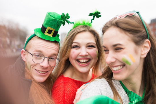 Group of Friends Taking a Picture with a Mobile Phone . St Patri