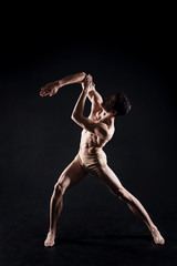 Fototapeta na wymiar Ingenious dancer performing in the studio