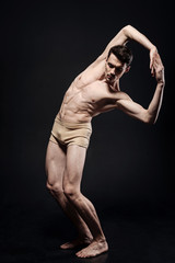 Gifted young ballet dancer performing in the studio