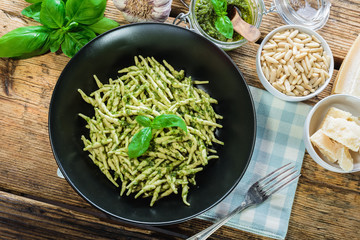 Trofie pasta with vegetarian sauce, pesto with pine nuts and bas