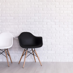 White and black chair in light interior