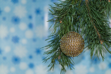 A Christmas toy - beautiful ball for the Christmas tree and Christmas decoration, on colorful background, soft focus..