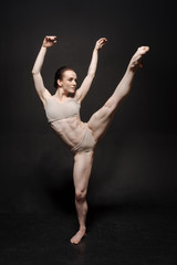 Graceful principal ballet dancer performing the twine