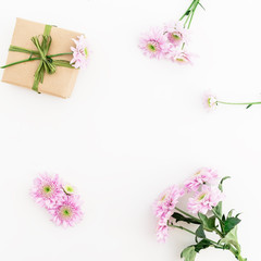 Valentines Day background. Gift box and chrysanthemum flowers isolated  on white background. Flat lay, top view. 