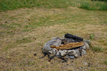 small camp fire pit in the middle of meadows