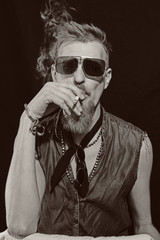 Young man with cigarette wearing a sunglasses