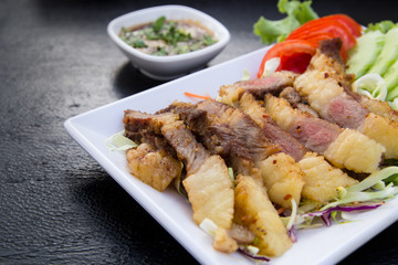 Grilled beef steak sliced with source , Thai Food