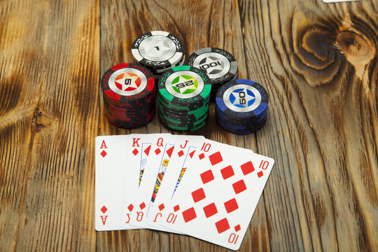 Combination of card game poker on the old wooden table