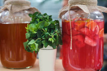 Closeup of lemonades in glass jars at restaurant background