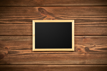 Picture frame on a wooden wall