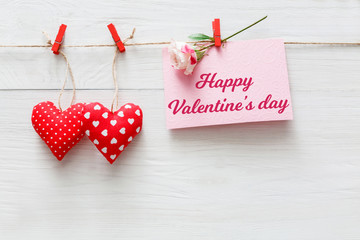 Valentine day background, pillow hearts border on wood, copy space