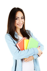 Fototapeta premium Portrait of a young student girl on a white background