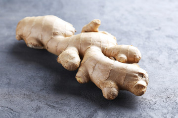 Ginger root on grey wooden table