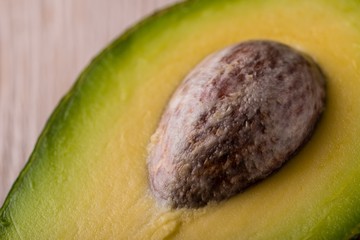 Detail of big avocado core in half of fruit