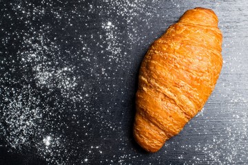 fresh croissant on a dark background