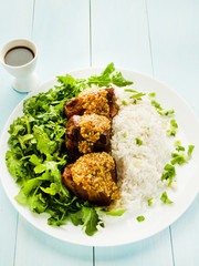Pork ribs with rice and rucola