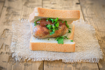 Sandwich with homemade sausage, spices and sauce.