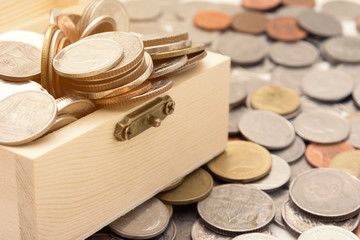 background of Thai coin with wooden trunk..banking and saving money conceptual.