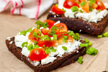 Sandwiches with healthy rye bread, feta and green onions. Love for a healthy food concept