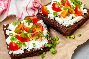 Sandwiches with healthy rye bread, feta and green onions. Love for a healthy food concept