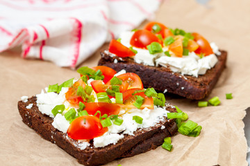 Sandwiches with healthy rye bread, feta and green onions. Love for a healthy food concept