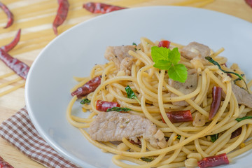 Spicy spagetti with stir-fried pork , dried chilli and basil : Thailand style food