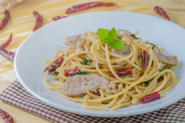 Spicy spagetti with stir-fried pork , dried chilli and basil : Thailand style food