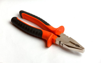 Red and black pliers on a white background