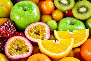 Naklejka na ściany i meble Closeup orange slice and passion fruit with various ripe fruits