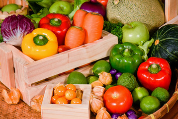 Various fresh fruits and vegetables in wooden container