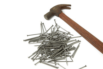 hand hammer with pile of nails