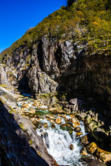 Fototapeta na wymiar Small waterfalls in beautiful western scenery, Norway