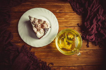 cup of tea and cake on a wooden table