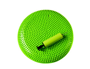 Green massage balance cushion for fitness and rehabilitation isolated on white background