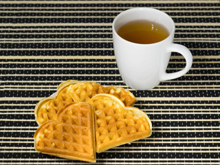 Tea and coffee with biscuits as the heart.
