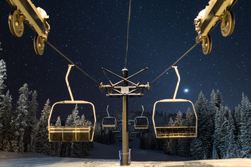 Ski lift under a cold and star filled night sky in the Elkhorn Mountains of Oregon