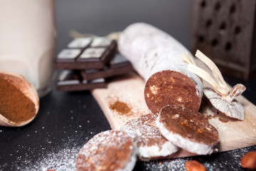 Sausage from chocolate on chopping board