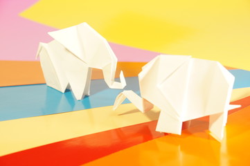 
Paper origami elephant isolated on a colorful background