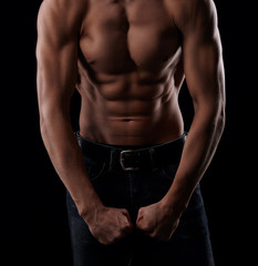 Fototapeta na wymiar Shirtless man with muscular torso posing