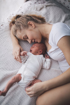 Portrait of mother and her newborn baby.