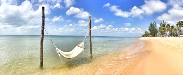 empty tropical beach hammock pano